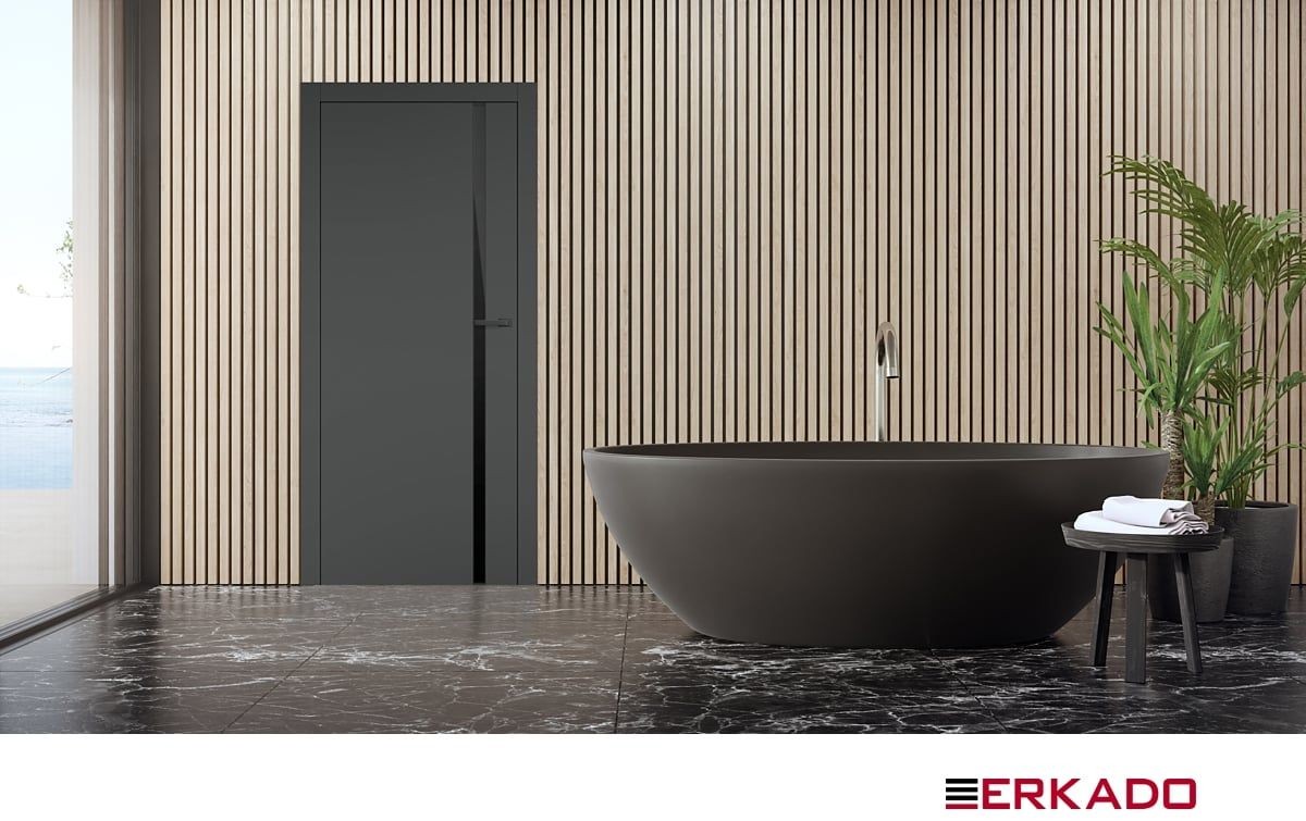 Modern bathroom with black bathtub, wooden slat wall, marble floor, and potted plants.